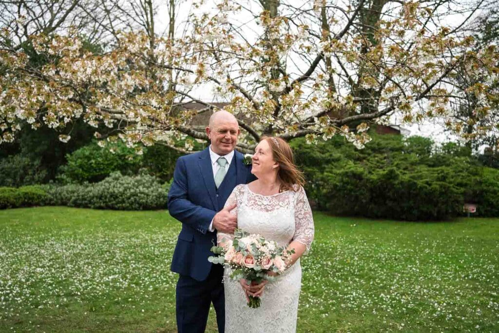 Bride and groom outside Mansion House registry office wedding venue in Newport photographed by South Wales wedding videographer.
